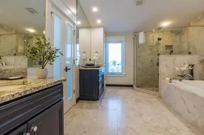 a bathroom with a tub and a sink and a shower at Pelican Paradise - Unit A in Seacrest