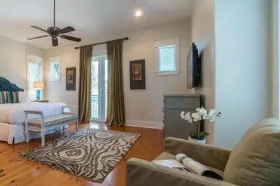 a living room with a bed and a couch at Pelican Paradise - Unit A in Seacrest