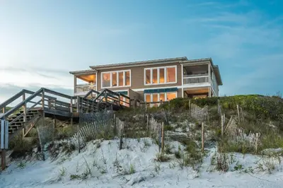 a house on top of a sand dune at Pelican Paradise in Seacrest