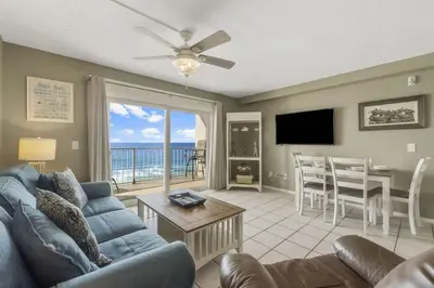 a living room with a couch and a table at The Summit 1128 in Panama City Beach