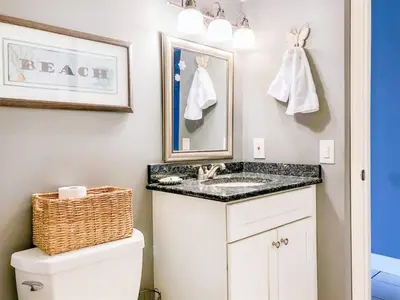 a bathroom with a sink and a toilet at The Summit 611 in Panama City Beach