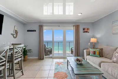 a living room with a couch and a table at The Summit 1409 in Panama City Beach