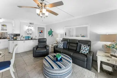 a living room with a couch and a table at The Summit 1130 in Panama City Beach