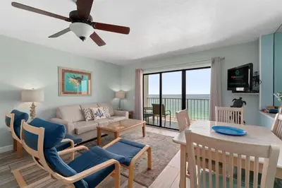 a living room with a couch and a table at The Summit 1030 in Panama City Beach