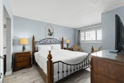 a bedroom with a bed and a television in it at The Summit 728 in Panama City Beach