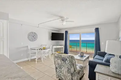 a living room with a view of the ocean at The Summit 1017 in Panama City Beach