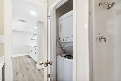 a bathroom with a sink and a mirror at Moondrifter 502 in Panama City Beach