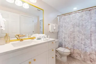 a bathroom with a sink and a toilet and a shower at Majestic T2 - 1606 in Panama City Beach