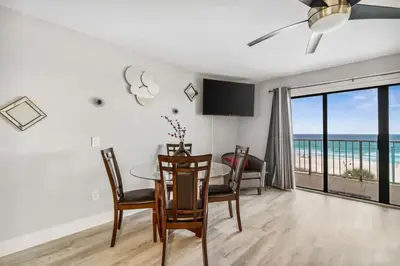 a dining room with a table and a view of the ocean at The Summit 531 in Panama City Beach