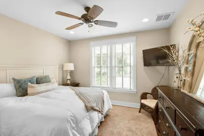 a bedroom with a bed and a ceiling fan at Sunny Side Up in Santa Rosa Beach