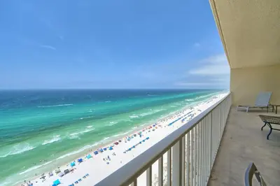 a view of the beach from the balcony of a condo at Luxurious Tropical Condo with Breathtaking Gulf View - Unit 2006 in Panama City Beach
