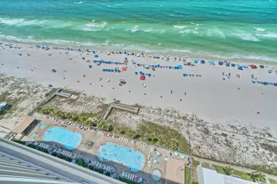 an overhead view of a beach with people at Luxurious Tropical Condo with Breathtaking Gulf View - Unit 2006 in Panama City Beach