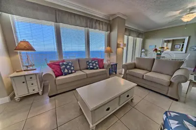 a living room with two couches and a table at Wondrous Condo with Beach Access and Poolside Beach - Unit 2103 in Panama City Beach
