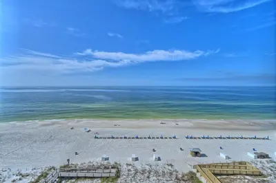 an aerial view of a beach with chairs and umbrellas at Marvelous Condo with Beachside Pool and Free Poolside WiFi - Unit 0902 in Panama City Beach