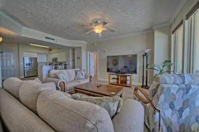 a living room with a couch and a table at Marvelous Condo with Beachside Pool and Free Poolside WiFi - Unit 0902 in Panama City Beach