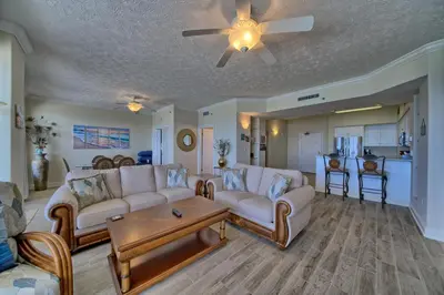 a living room with couches and a ceiling fan at Marvelous Condo with Beachside Pool and Free Poolside WiFi - Unit 0902 in Panama City Beach