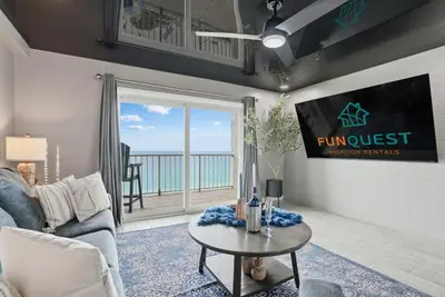 a living room with a couch and a table at The Summit 1217 in Panama City Beach