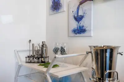 a white table with glasses on top of it at The Summit 1205 in Panama City Beach