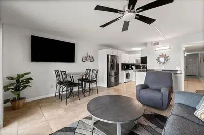 a living room with a couch and a table at The Summit 620 in Panama City Beach
