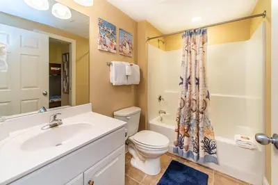a bathroom with a sink and a toilet and a shower at Majestic Beach Towers 2-403 in Panama City Beach