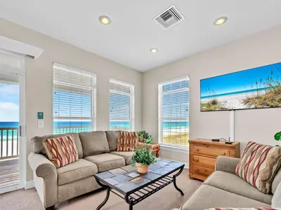 a living room with a couch and a table at Ocean Spray in Panama City