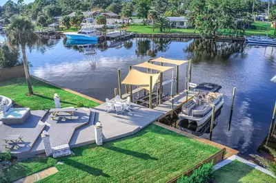 a marina with boats and a dock in the water at Bay Shore in Panama City Beach