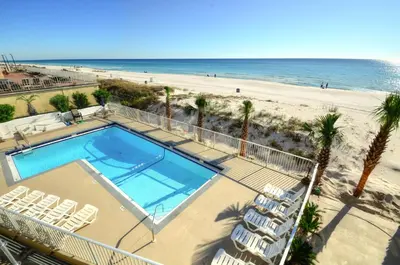 an overhead view of a swimming pool and the beach at Sea Glass Villa in Panama City Beach