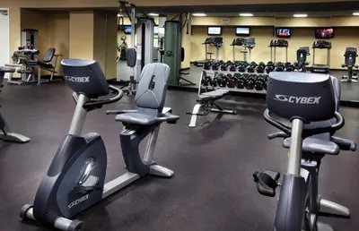 a gym with several treadmills and exercise bikes at Club Wyndham Panama City Beach in Panama City Beach