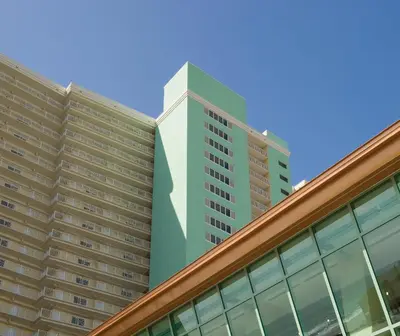 a tall green building on top of a building at Club Wyndham Panama City Beach in Panama City Beach