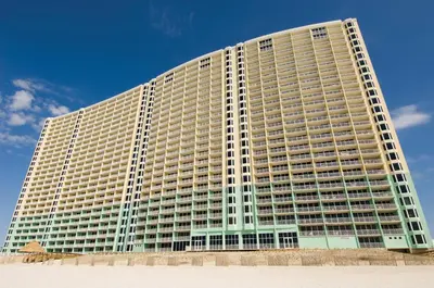 a large tall building with a blue sky in the background at Club Wyndham Panama City Beach in Panama City Beach