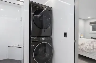 a black washer and dryer in a room at The Summit 616 in Panama City Beach
