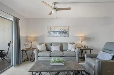 a living room with a couch and a table at The Summit 621 in Panama City Beach