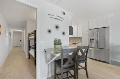 a kitchen with a table and chairs in a room at The Summit 621 in Panama City Beach