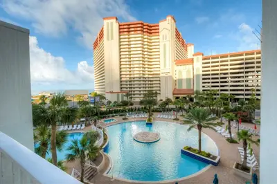 a view of a resort with a large swimming pool at Laketown Wharf 429 By Aneliya in Panama City Beach