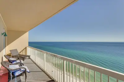 a balcony with chairs and a view of the ocean at Gulf Coast Getaway with Balcony and Resort Amenities! in Panama City Beach