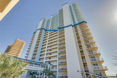 a tall building with a blue ribbon on it at Gulf Coast Getaway with Balcony and Resort Amenities! in Panama City Beach