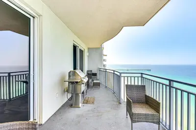 a balcony with chairs and a view of the ocean at Panama City Beachfront Condo with Breathtaking Views in Panama City Beach