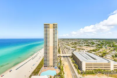 an overhead view of a tall building next to the beach at Panama City Beachfront Condo with Breathtaking Views in Panama City Beach