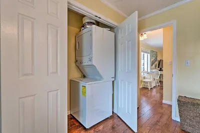 a kitchen with a refrigerator in a room at Convenient PCB Condo with Pool Access Walk to Beach in Panama City Beach