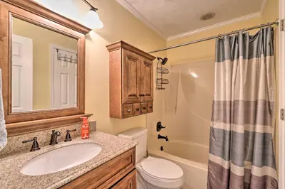 a bathroom with a sink and a toilet and a shower at Convenient PCB Condo with Pool Access Walk to Beach in Panama City Beach