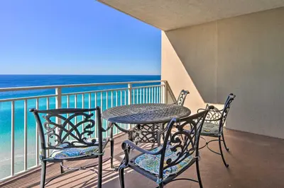 a table and two chairs on a balcony with the ocean at Oceanfront PCB Condo with Balcony and Pool Access! in Panama City Beach