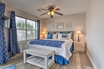 a bedroom with a bed and a ceiling fan at Seagrove Beach Condo with Pool Access Walk to Beach in Seagrove Beach