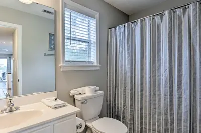 a bathroom with a toilet and a sink at Seagrove Beach Condo with Pool Access Walk to Beach in Seagrove Beach