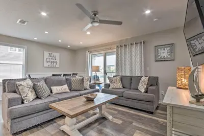 a living room with a couch and a table at Seagrove Beach Condo with Pool Access Walk to Beach in Seagrove Beach