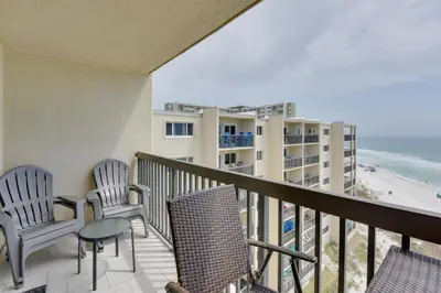a balcony with chairs and a view of the ocean at Panama City Beach Retreat with Pool and Ocean Views! in Panama City Beach