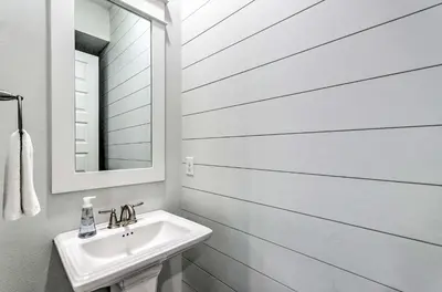a white bathroom with a sink and a mirror at Always Saturday Prominence Resort Townhome! in Inlet Beach