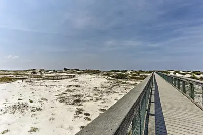 a boardwalk over the sand at the beach at Always Saturday Prominence Resort Townhome! in Inlet Beach