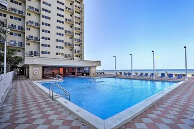 a large swimming pool in front of a building at Oceanfront PCB Condo with Beach Access and 2 Pools in Panama City Beach