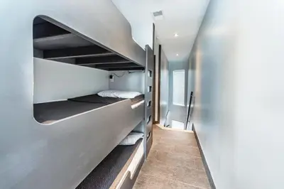 a small room with a bunk bed in it at Klaus House 1 in Panama City Beach