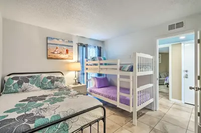 a bedroom with a bunk bed and a bunk bed at Chic PCB Condo with Pool Access and Beachfront Balcony in Panama City Beach